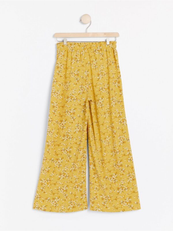 Wide yellow trousers with floral pattern - 7964865-7149