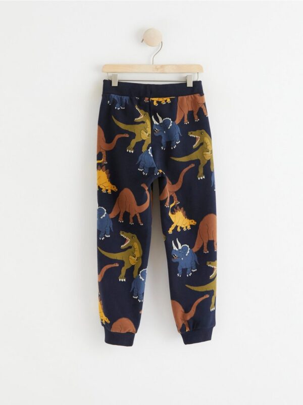 Trousers with dinosaurs - 8399410-2521
