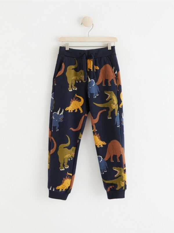 Trousers with dinosaurs - 8399410-2521